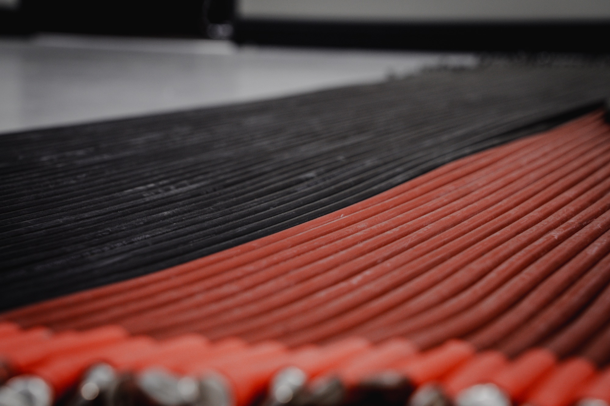 Close-up of colour-coded cable looms inside a distribution board