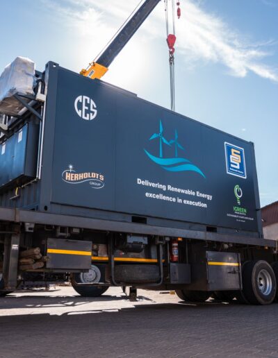 Containerised energy unit being moved by a truck