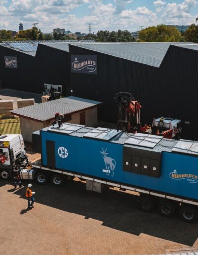 Aerial view of a containerised energy unit in front of a Herholdt's facility