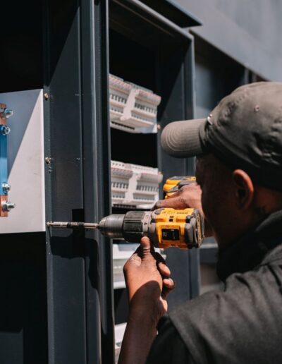 fixing screws into an electrical cabinet