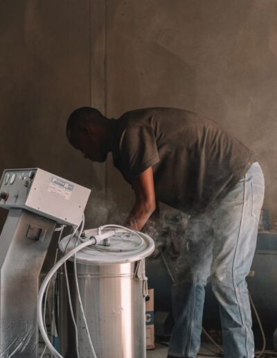 A worker preparing a compressor