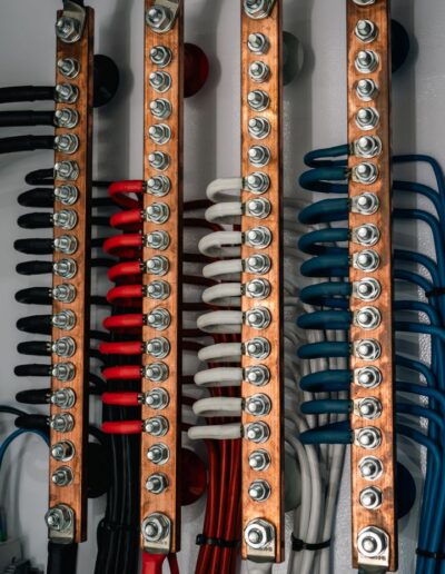 Detailed view of neatly organized electrical wiring in a cabinet.
