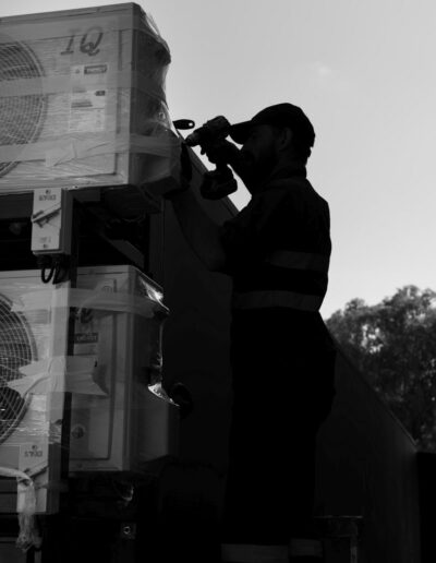 Silhouette of an Industrialec engineer working on a container