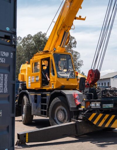 Crane next to a container