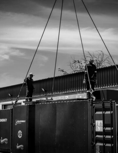 Container attached to a crane