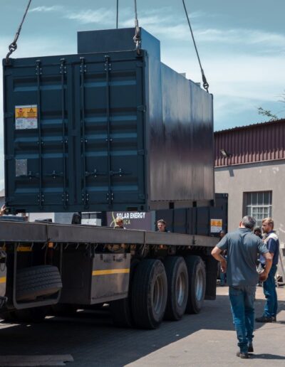 Container being moved from a truck